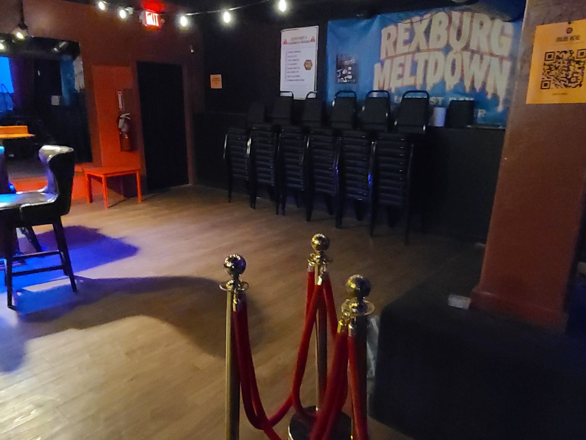 The downstairs floor today, with velvet rope stands and stacked chairs along the wall